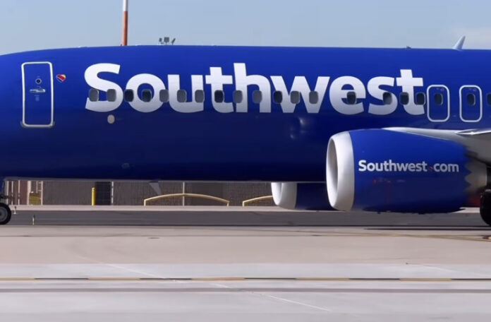 a blue airplane with white text on it