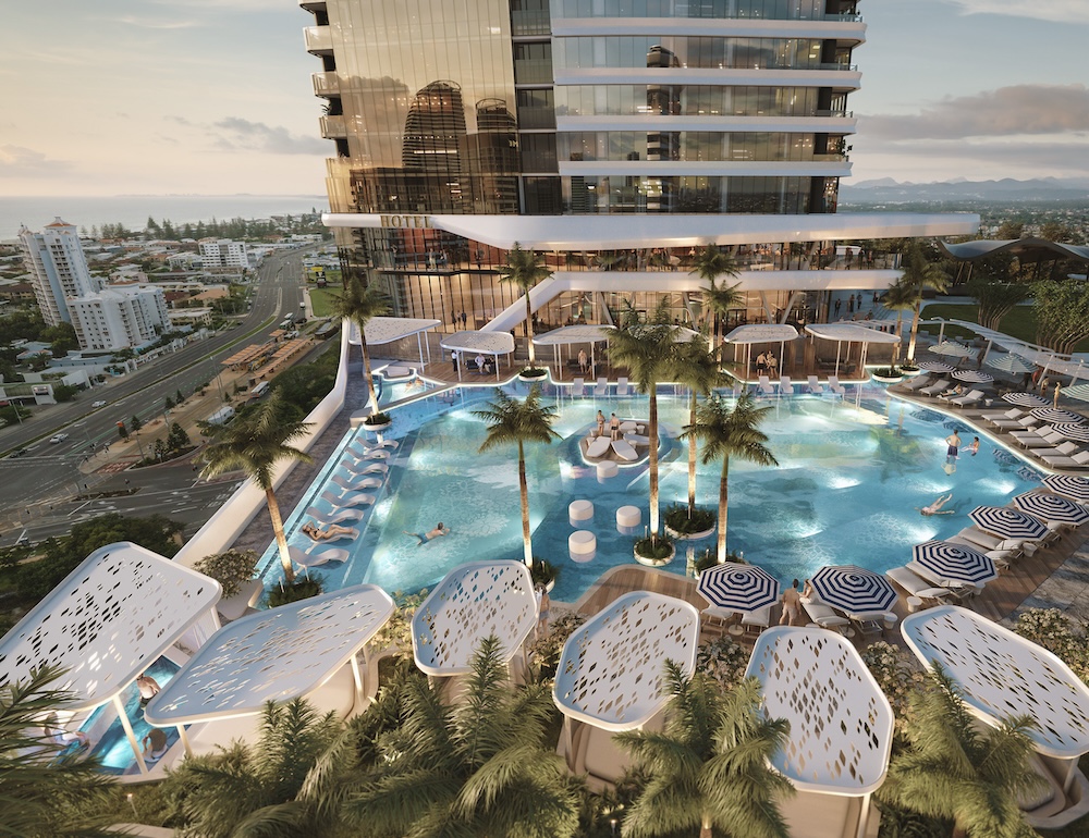 a pool with palm trees and a building