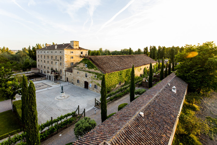 a building with a courtyard and trees