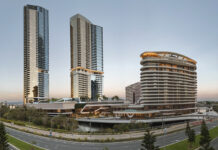 a group of tall buildings next to a road