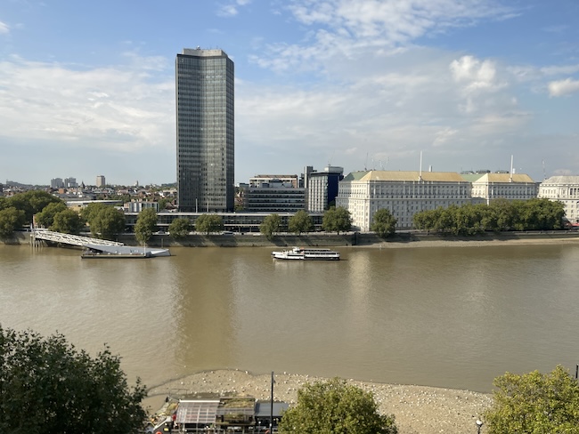 a river with a city and buildings