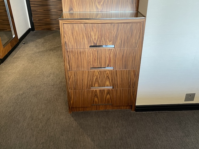 a wooden dresser in a room