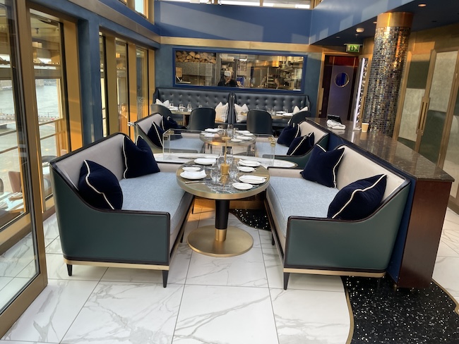 a restaurant with a table and chairs