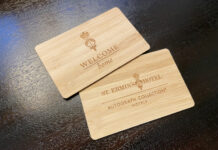 a couple of wooden business cards