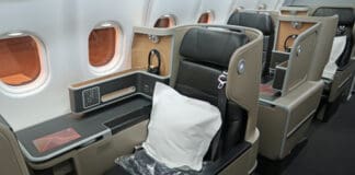 a seat with a pillow in the middle of the seat