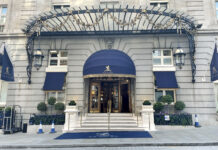 a building with a blue awning