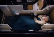 a woman lying in a bed