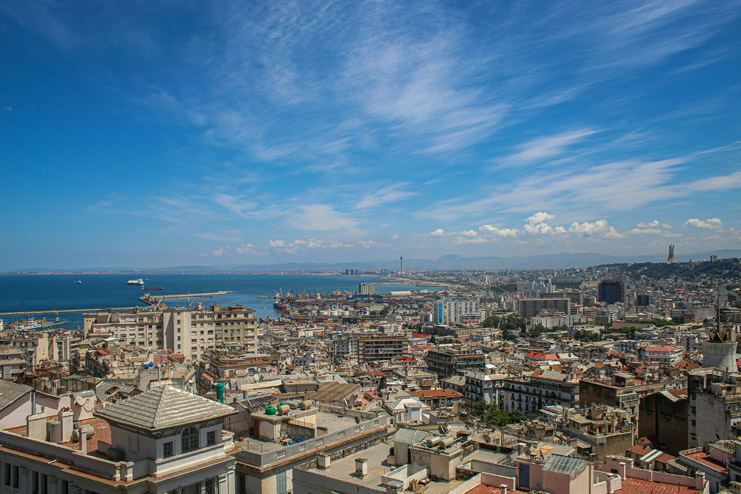 a city with many buildings and a body of water