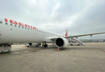 a large white airplane with red writing on it