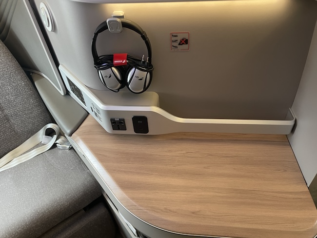 Iberia A321XLR Business Class seat with headphones.