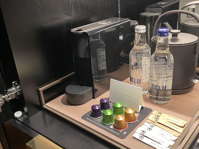 a coffee machine and coffee capsules on a table