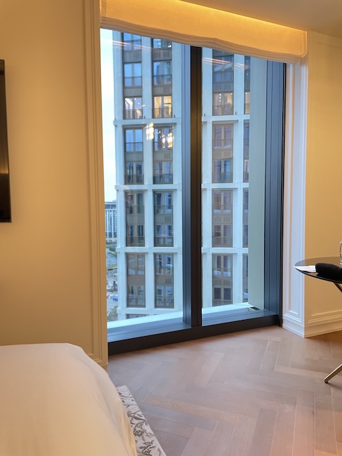 a bedroom with a large glass door