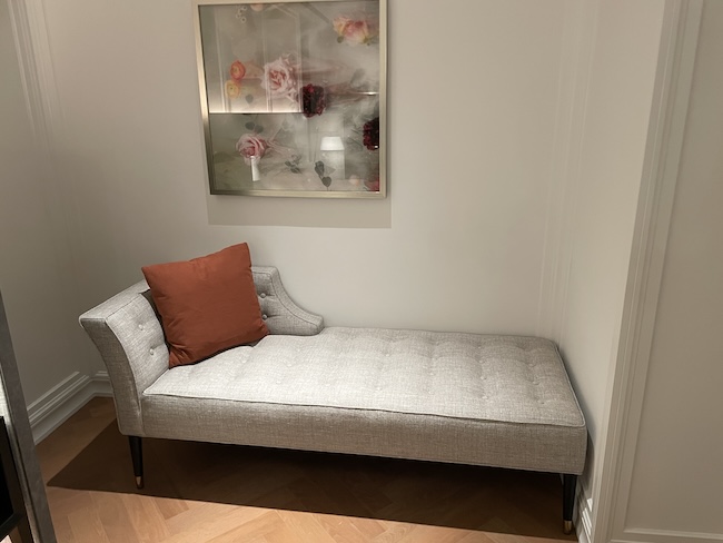 a chaise lounge in a room