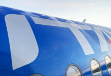 a blue and white airplane with windows