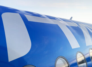 a blue and white airplane with windows