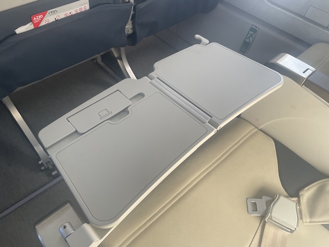 an airplane seat with a seat open