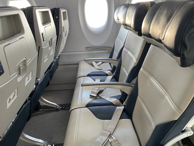 seats in an airplane with a window