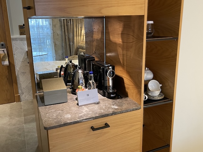 a kitchen counter with coffee maker and other appliances