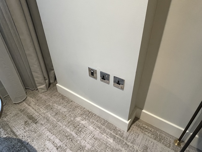 a wall with switches on it