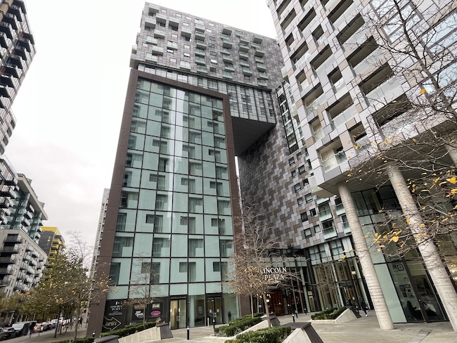 a group of tall buildings with glass windows