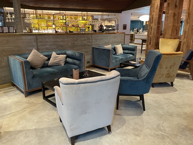 a room with chairs and a bar