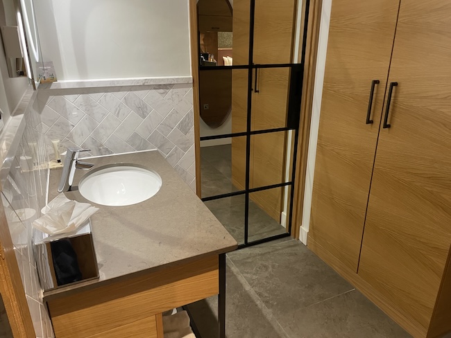 a bathroom with a sink and a glass door