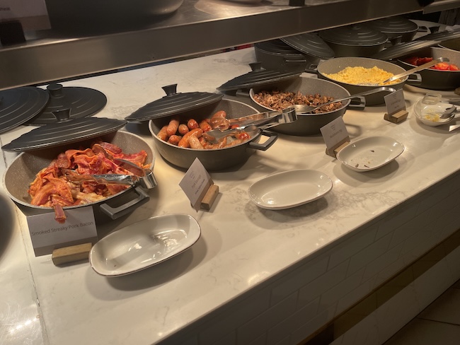 a buffet table with food in bowls