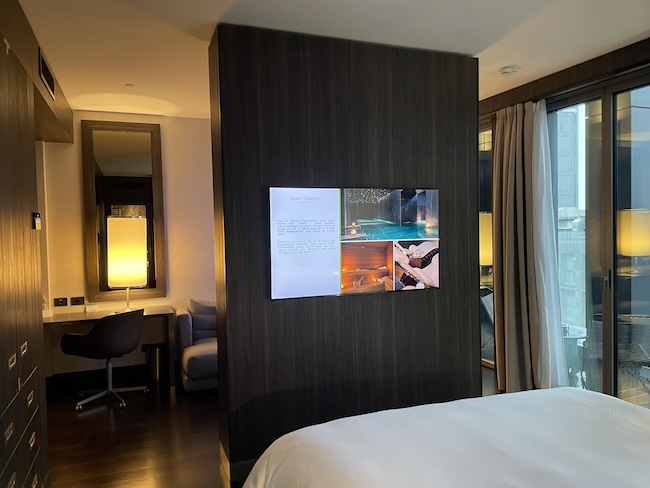 a room with a bed and a desk