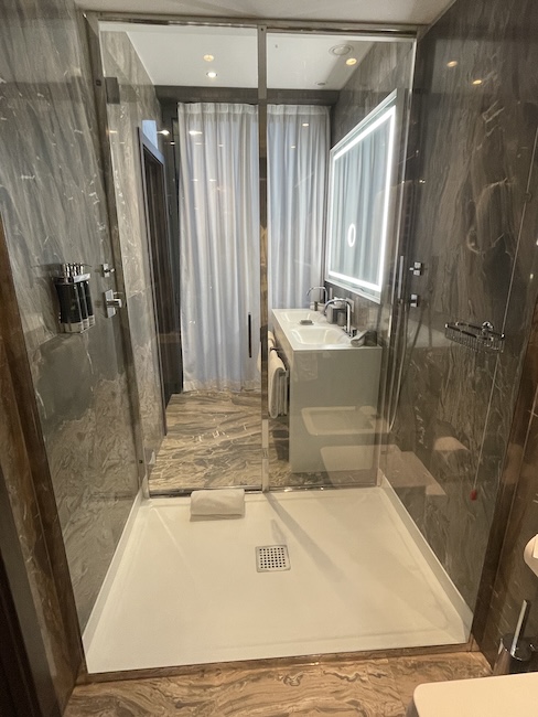 a bathroom with a glass shower