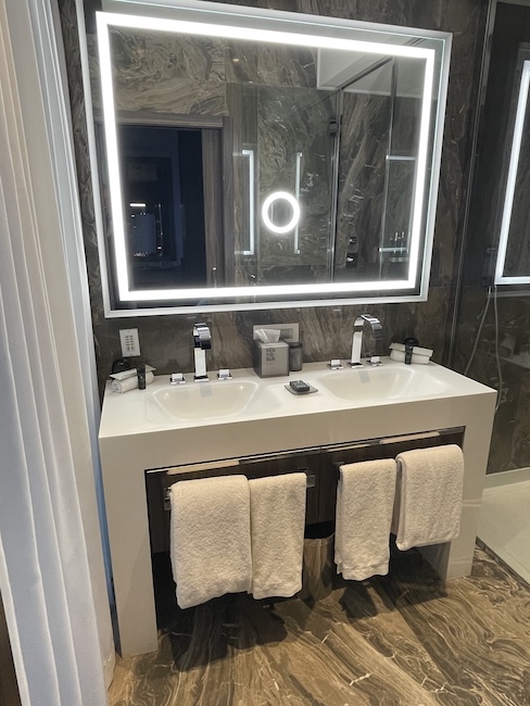 a bathroom with a mirror and sink