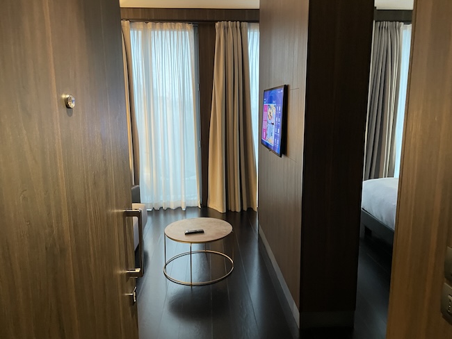 a room with a television and a bed