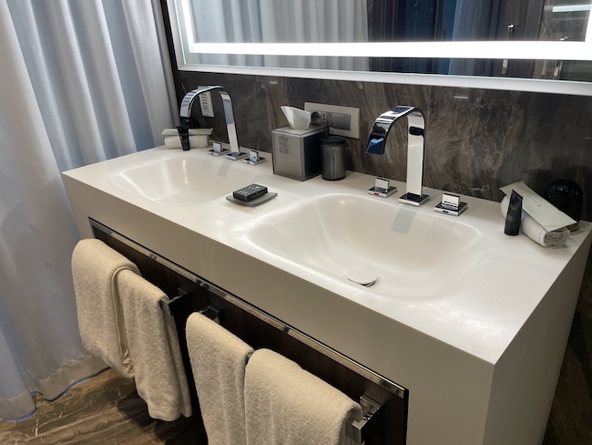 a bathroom with a mirror and sinks