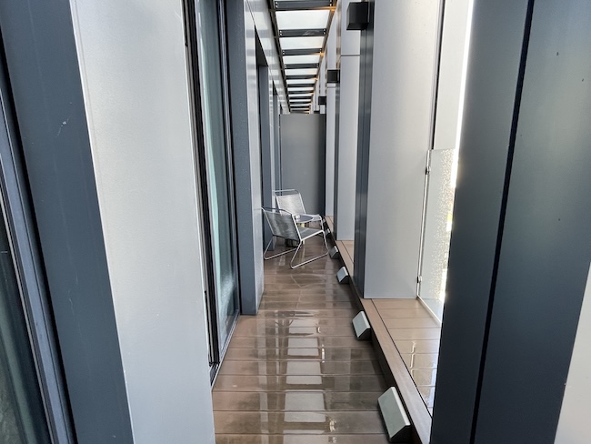 a hallway with a chair
