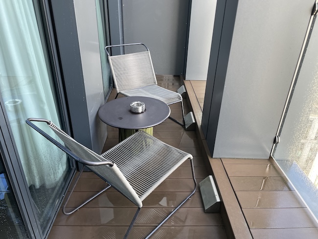 a chair and table on a deck