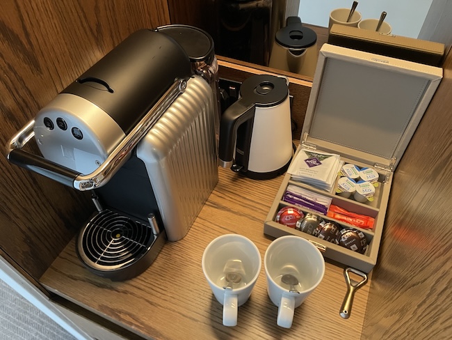 a coffee machine and coffee cups on a counter