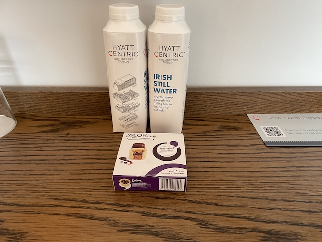 a group of white containers next to a box
