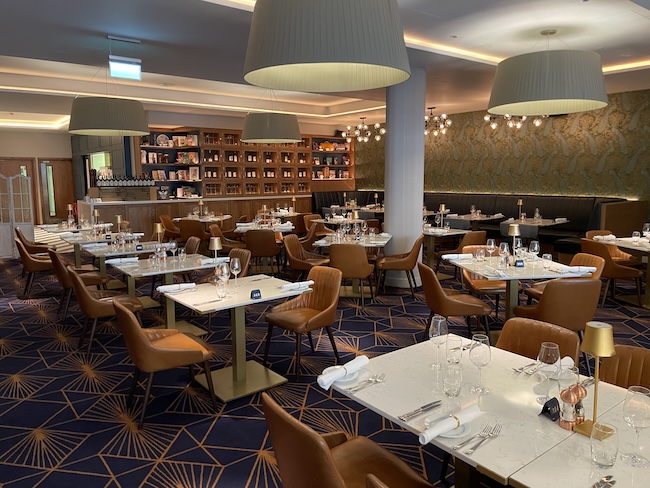 a restaurant with tables and chairs
