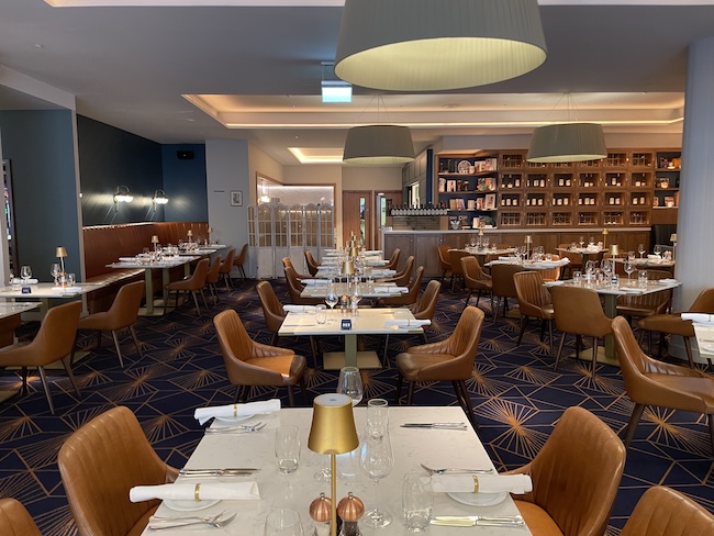 a restaurant with tables and chairs