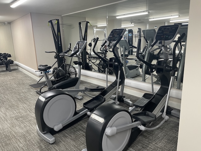 a group of exercise machines in a room