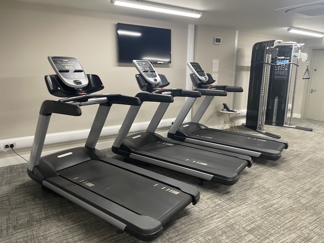 a group of treadmills in a room