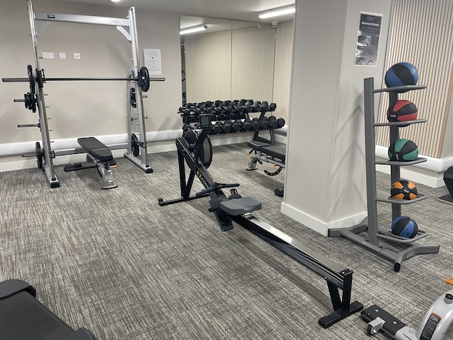 a gym with weights and equipment