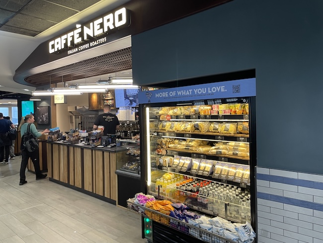 a store with a counter and shelves of food