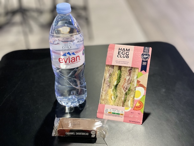 a bottle of water and a sandwich
