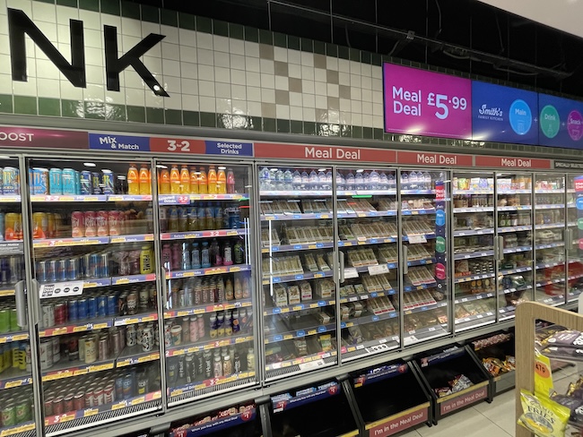 a grocery store with shelves of beverages