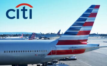 a group of airplanes parked at an airport