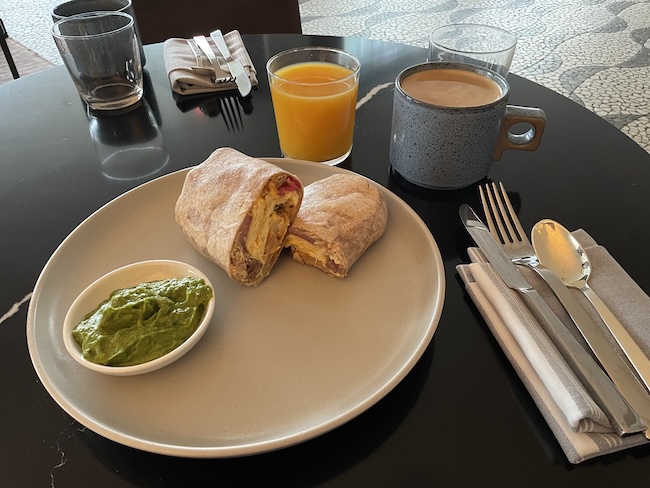 a plate of food and drinks on a table