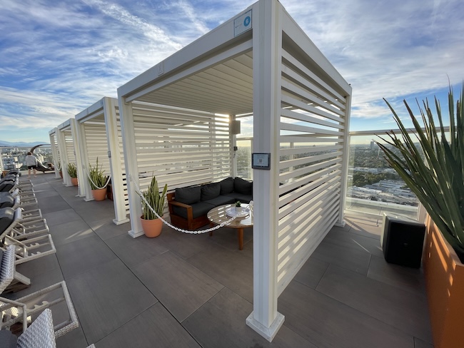 a white pergola on a roof