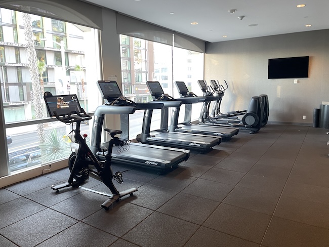 a room with treadmills and exercise bikes
