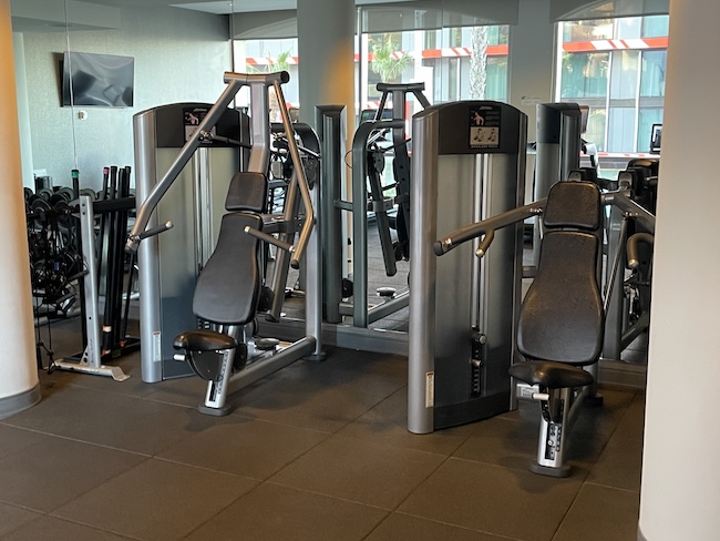 a group of exercise equipment in a gym