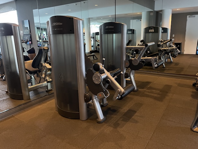 a group of exercise equipment in a gym